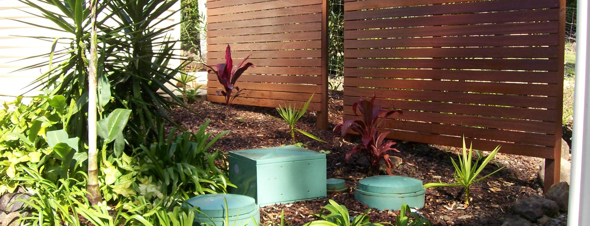 Landscaped property with RP10 service lids visible